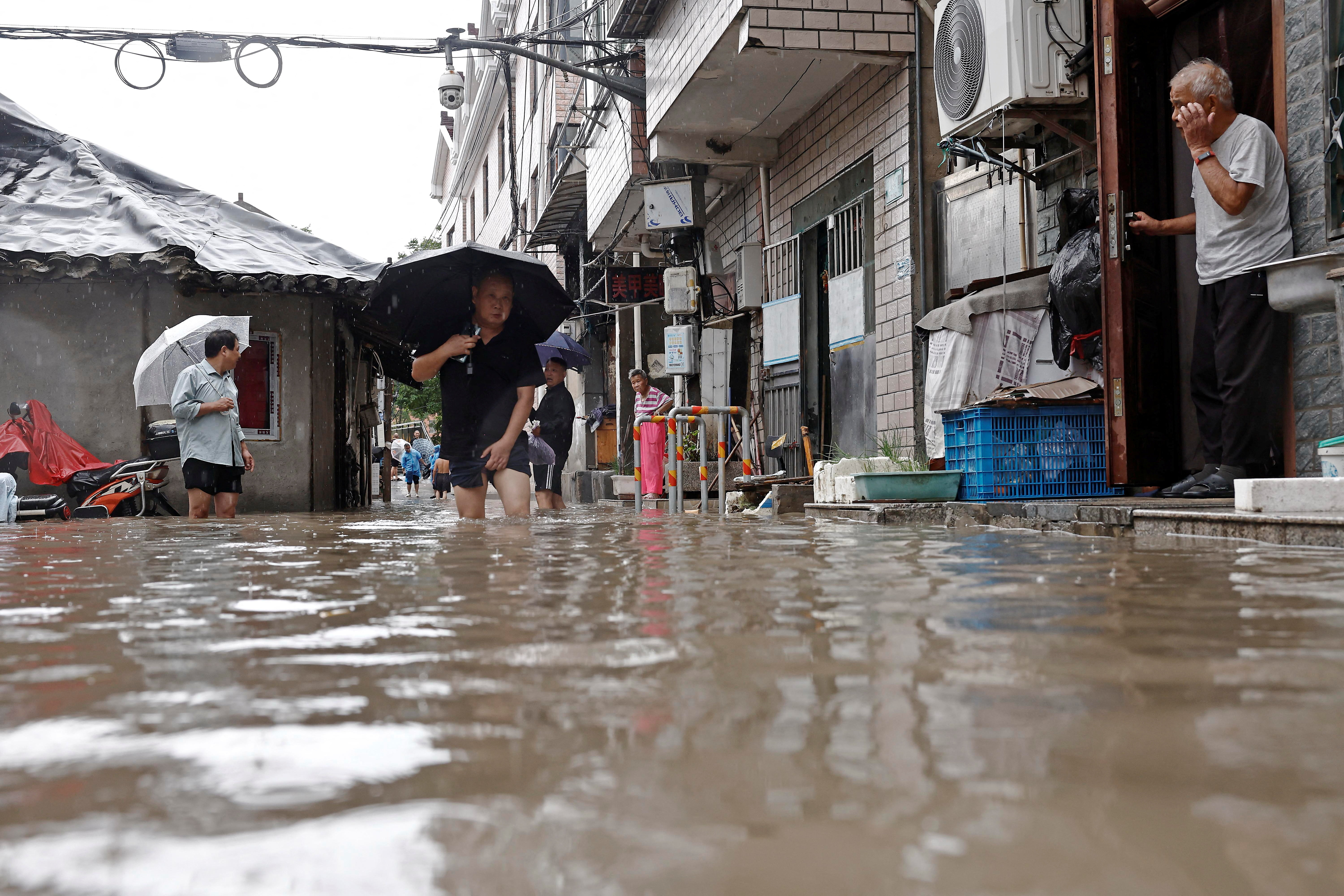 cover Beijing braces for deluge as Typhoon Dolphin moves deeper into China
