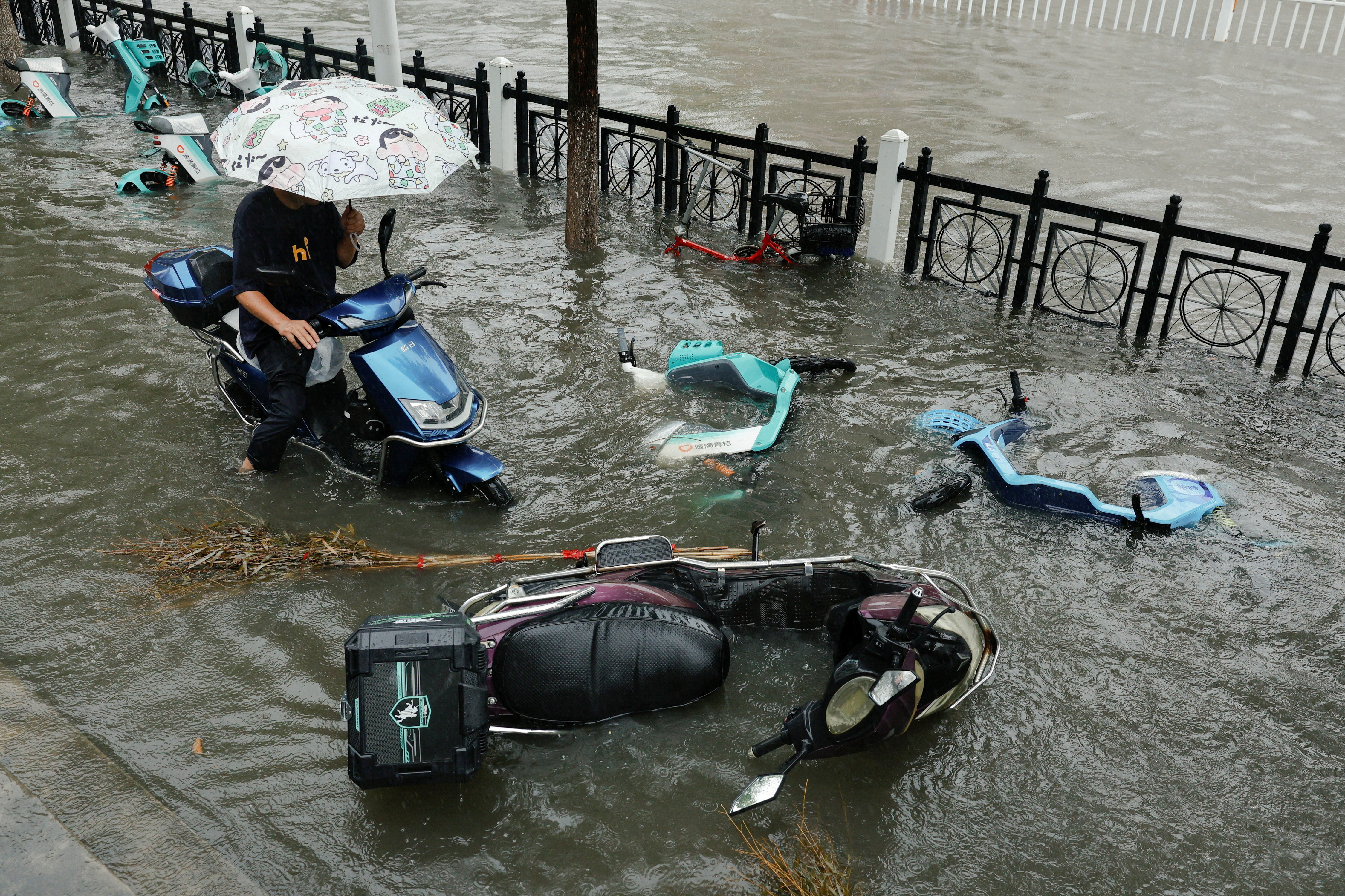 cover Rain pounds Beijing as Typhoon Dolphin sweeps through China