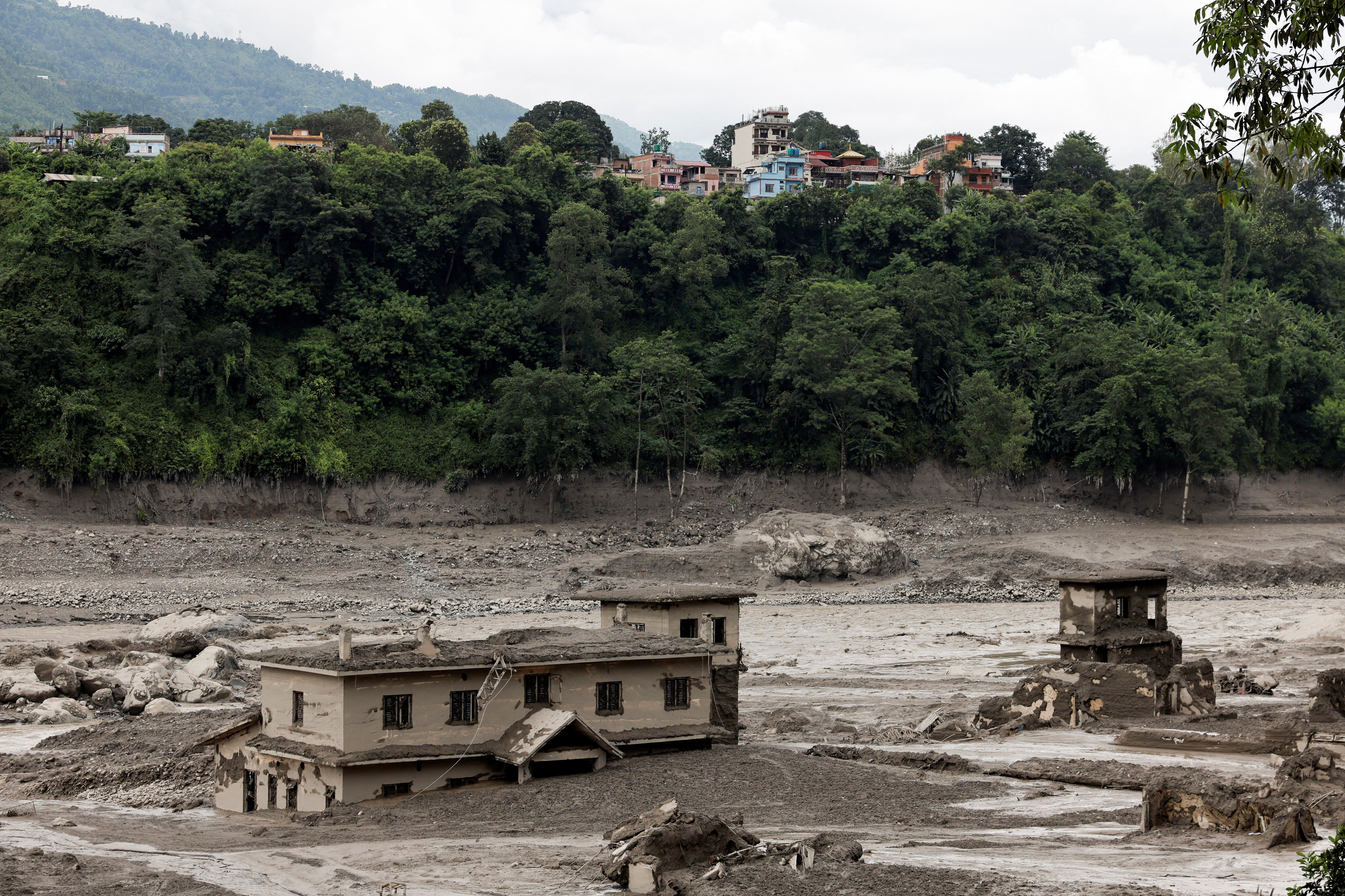 cover Glacier collapse may have triggered deadly Nepal flash flood, experts say