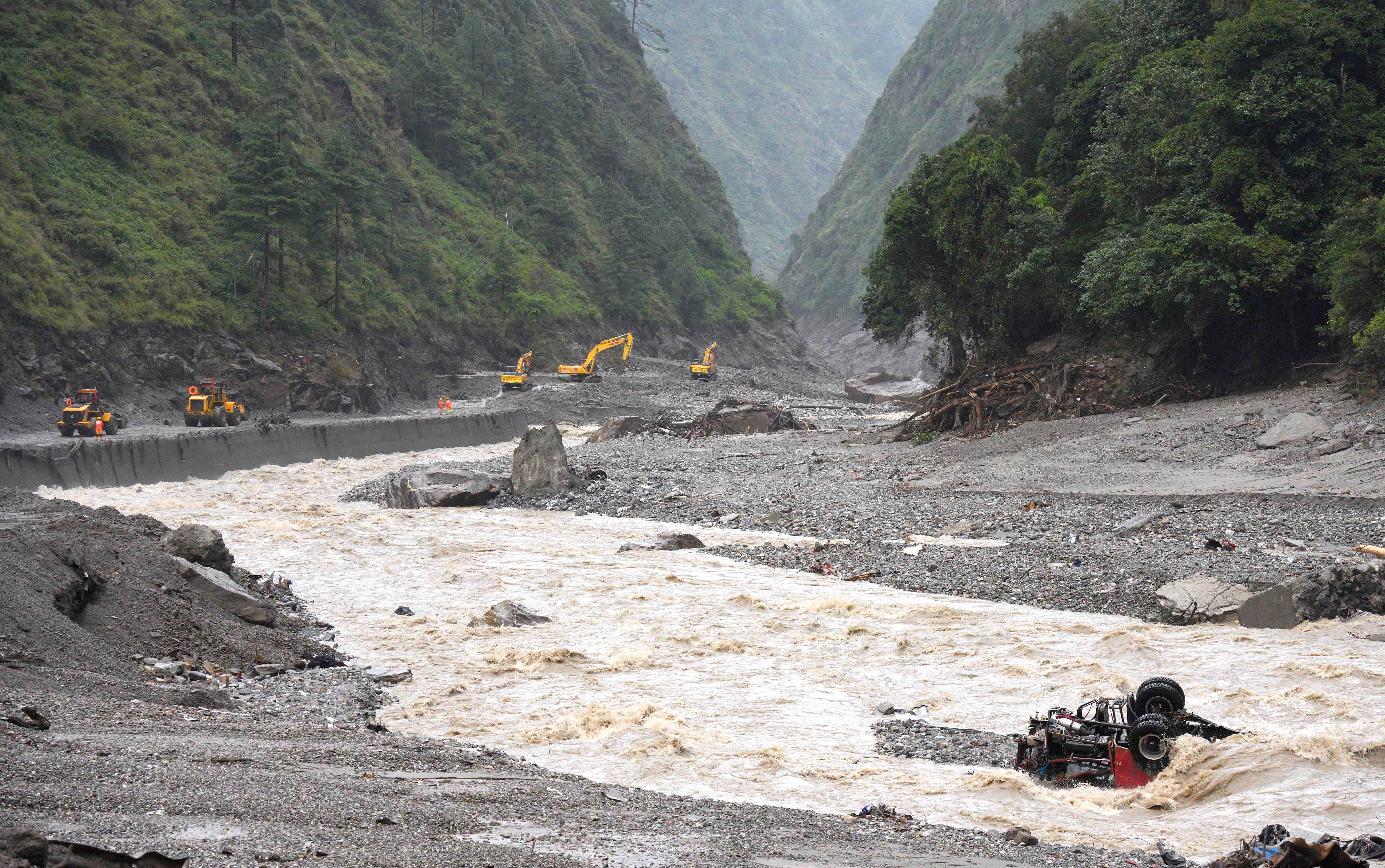 cover Rescuers scour Nepal flood debris as risk of fresh flooding grows