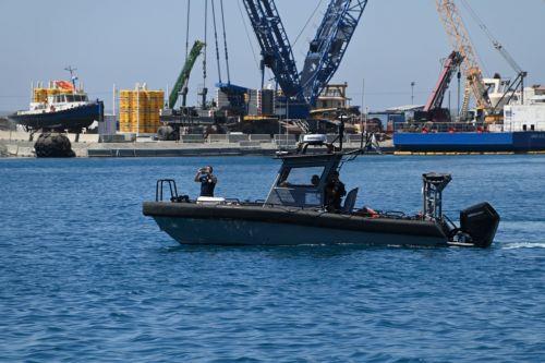 cover Larnaca, Vasiliko and Latchi port plans on the table