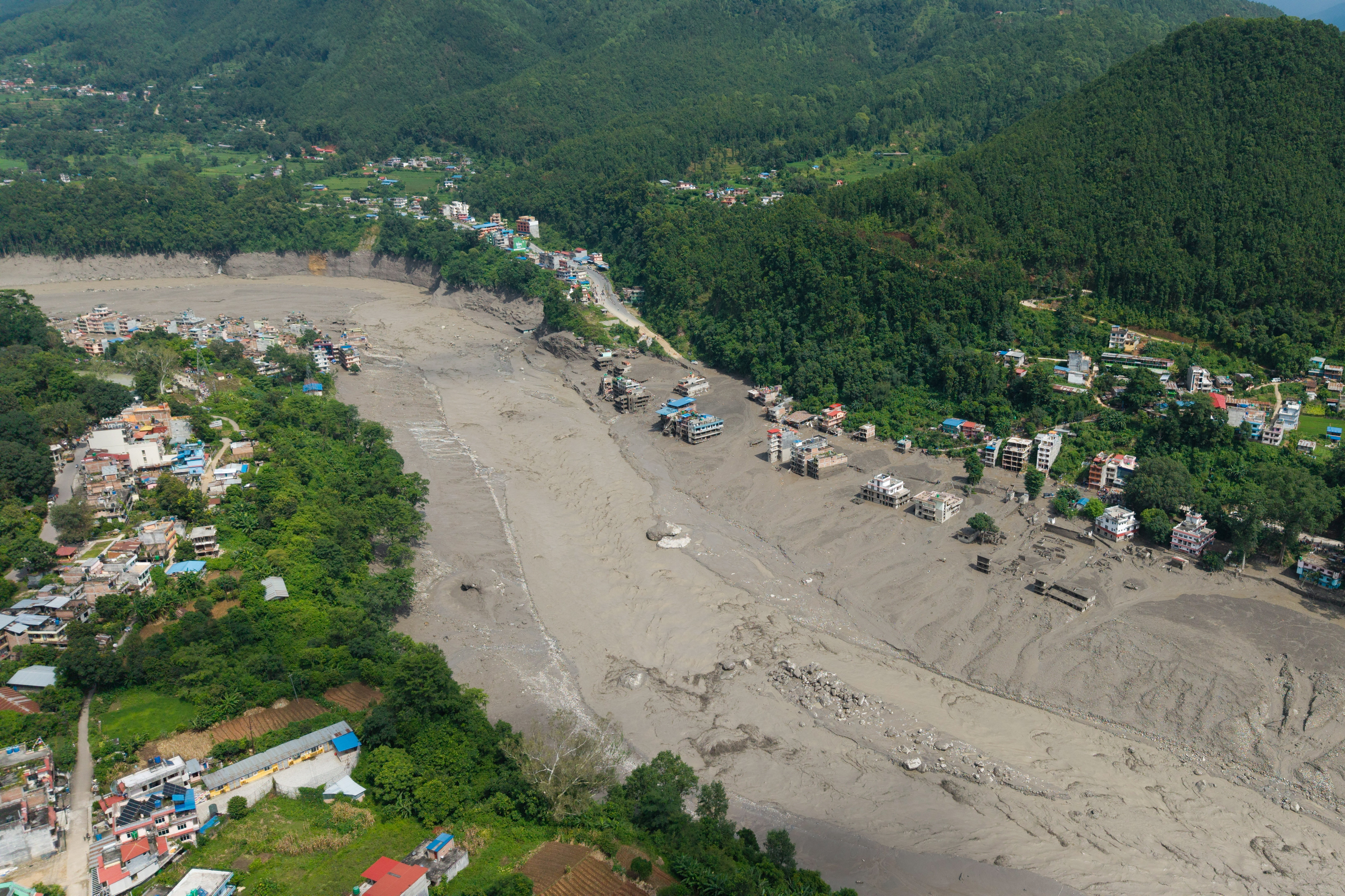 cover Hundreds missing after devastating flood hits Nepal-Tibet border