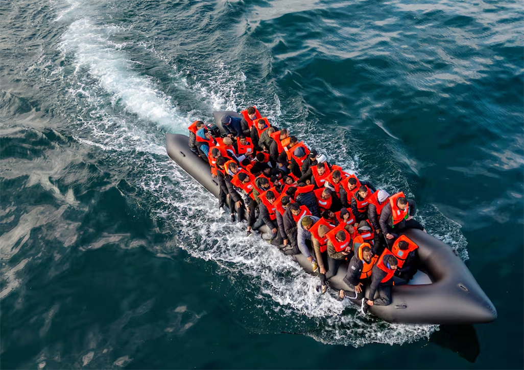 image French coastguards rescue 157 from burning migrant boat in English Channel