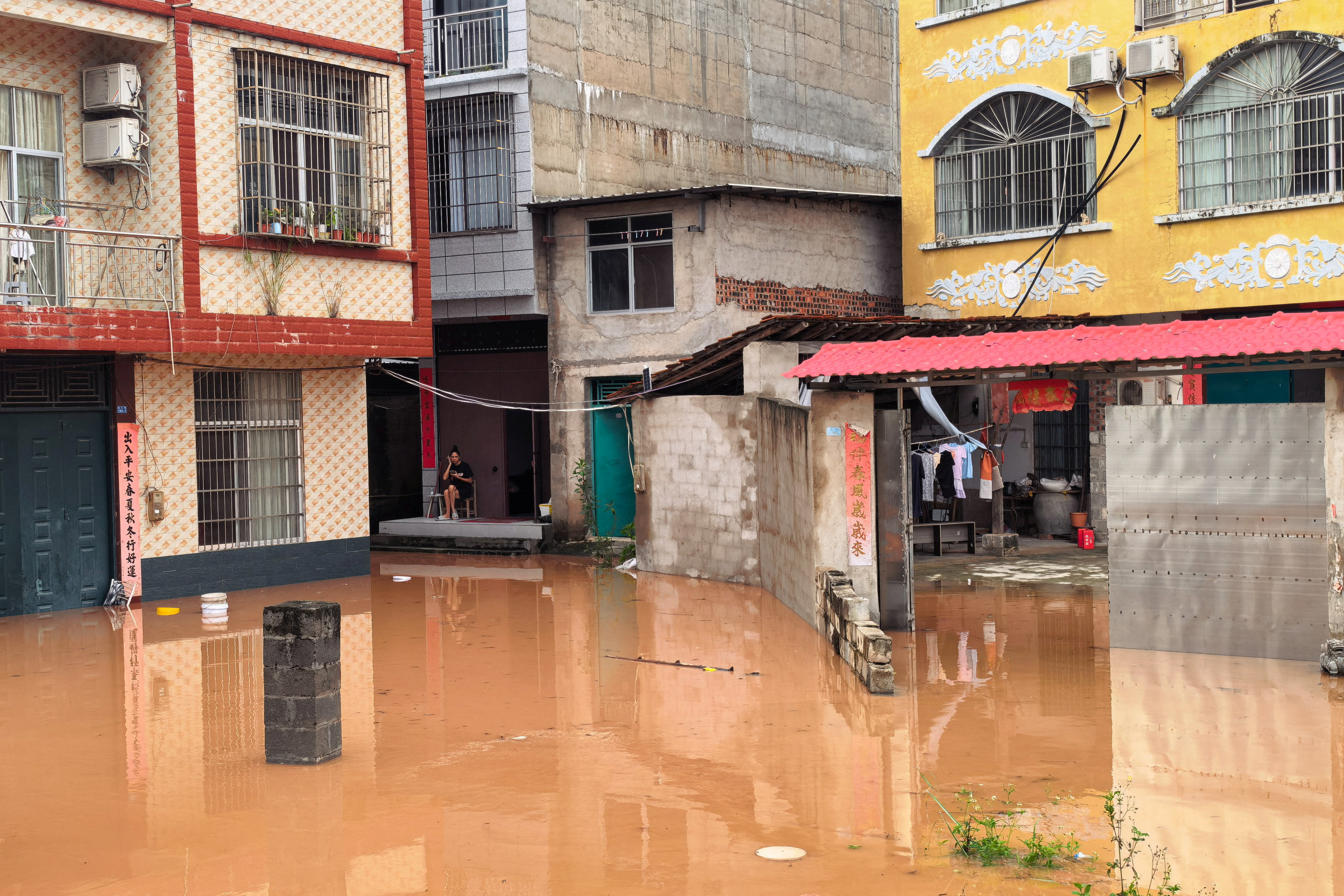 cover Homes submerged, tens of thousands relocated in China&#8217;s south as flooding intensifies
