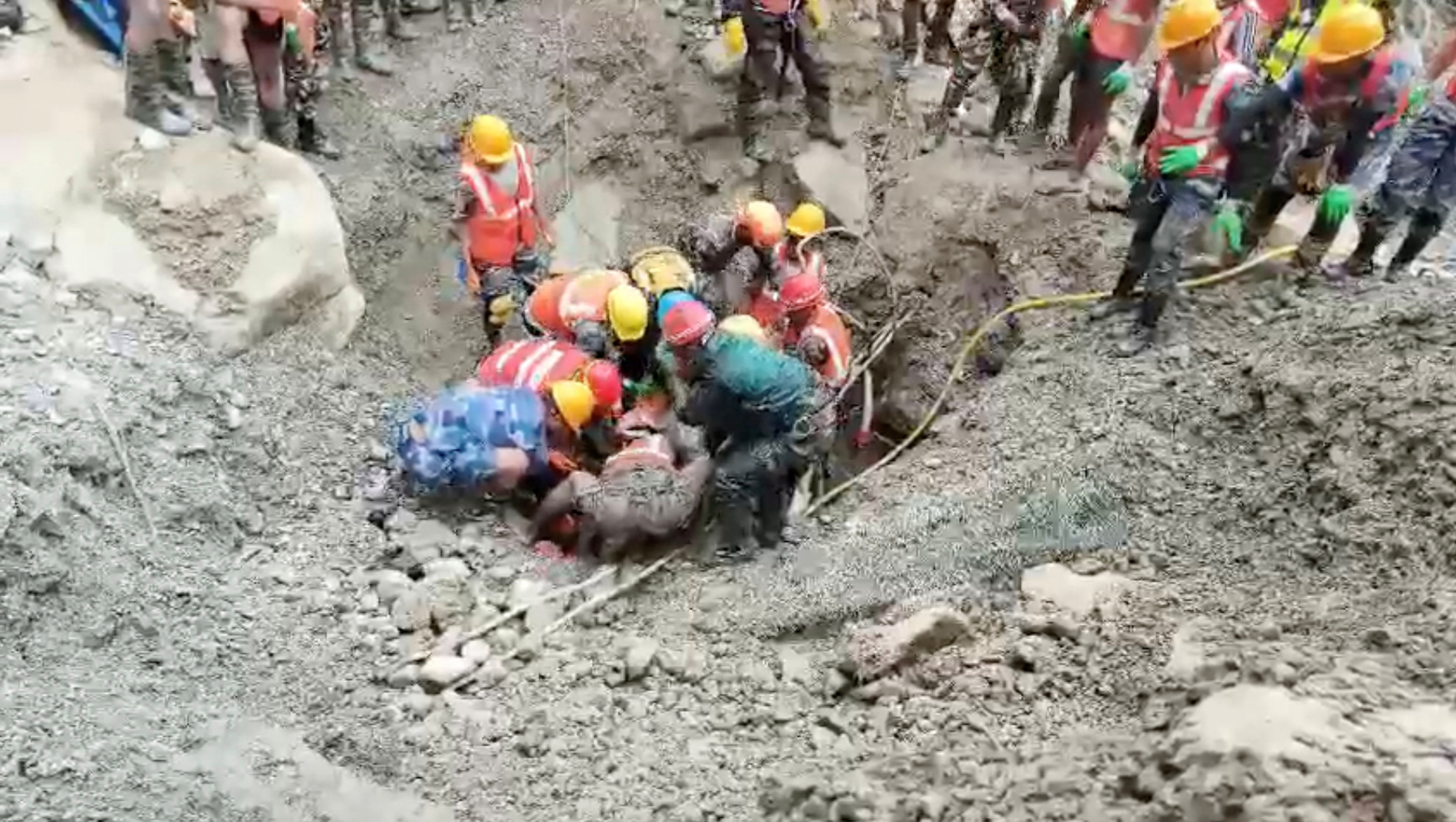 cover Two people rescued alive nine days after Nepal deadly flash flood