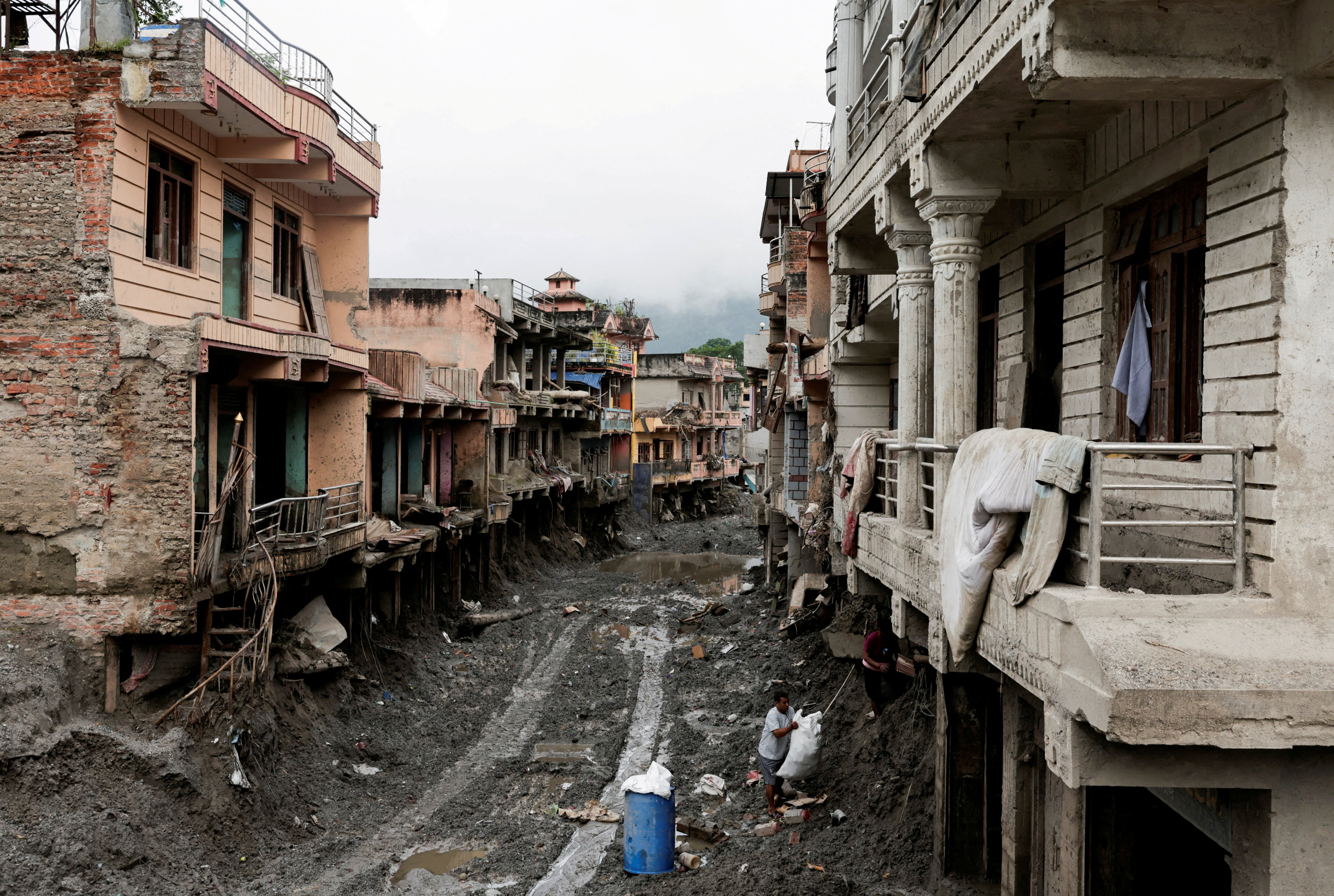 cover Floods, landslides kill 56 in India and 14 in Nepal