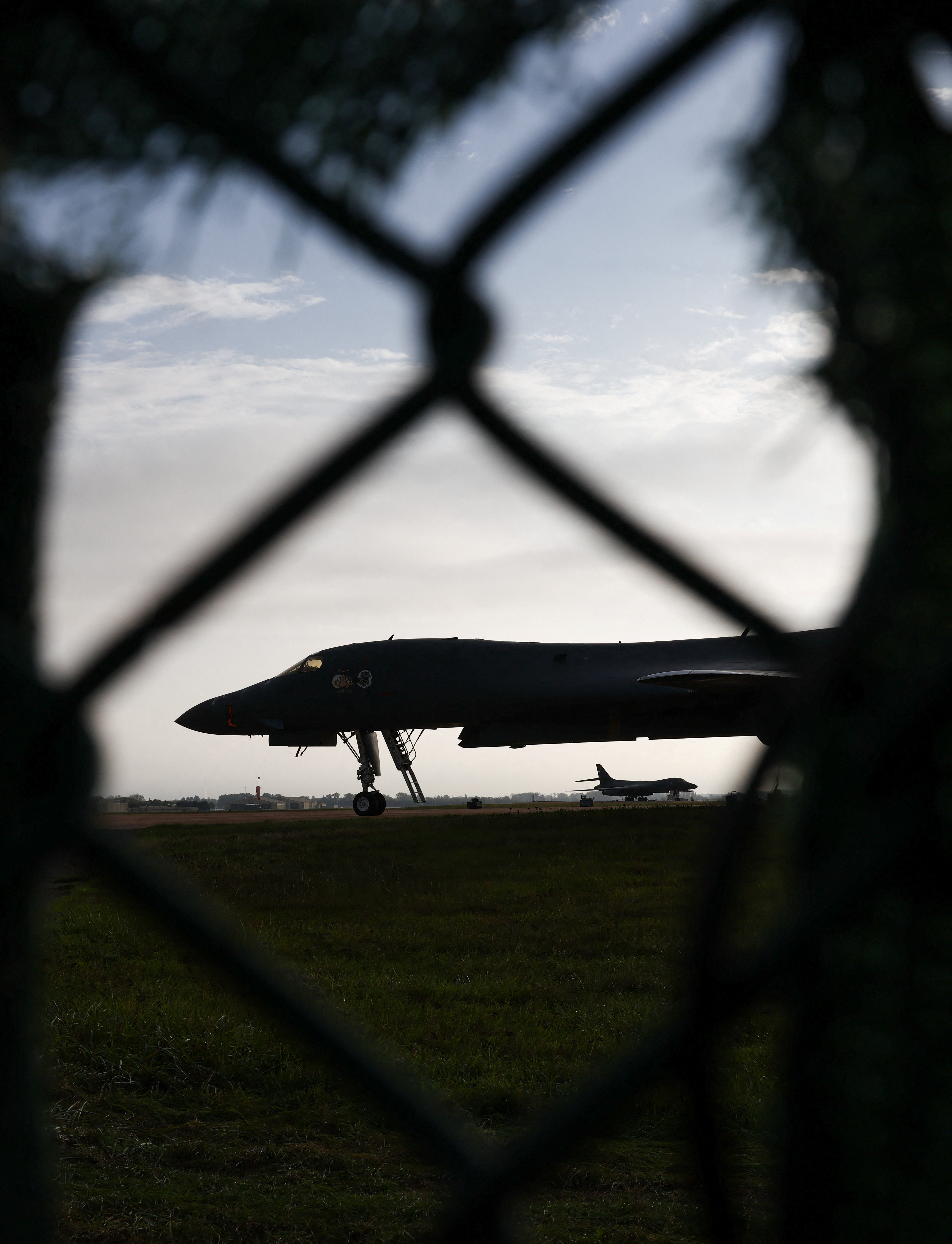 cover UK probes foreign state link to suspected RAF Fairford attack plot, suspects released on bail