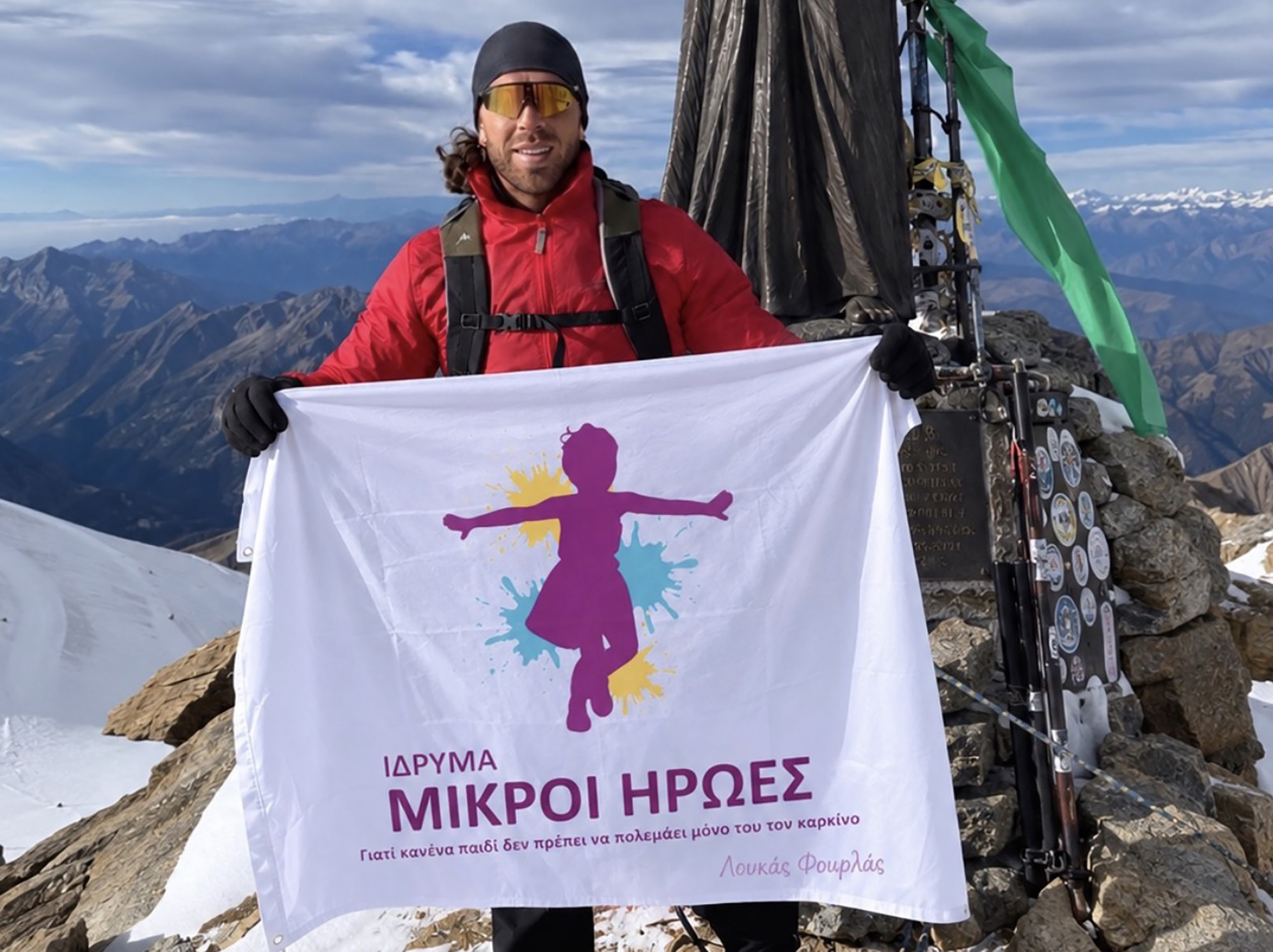 cover Cyprus climbers raise cancer charity flag in Italian Alps