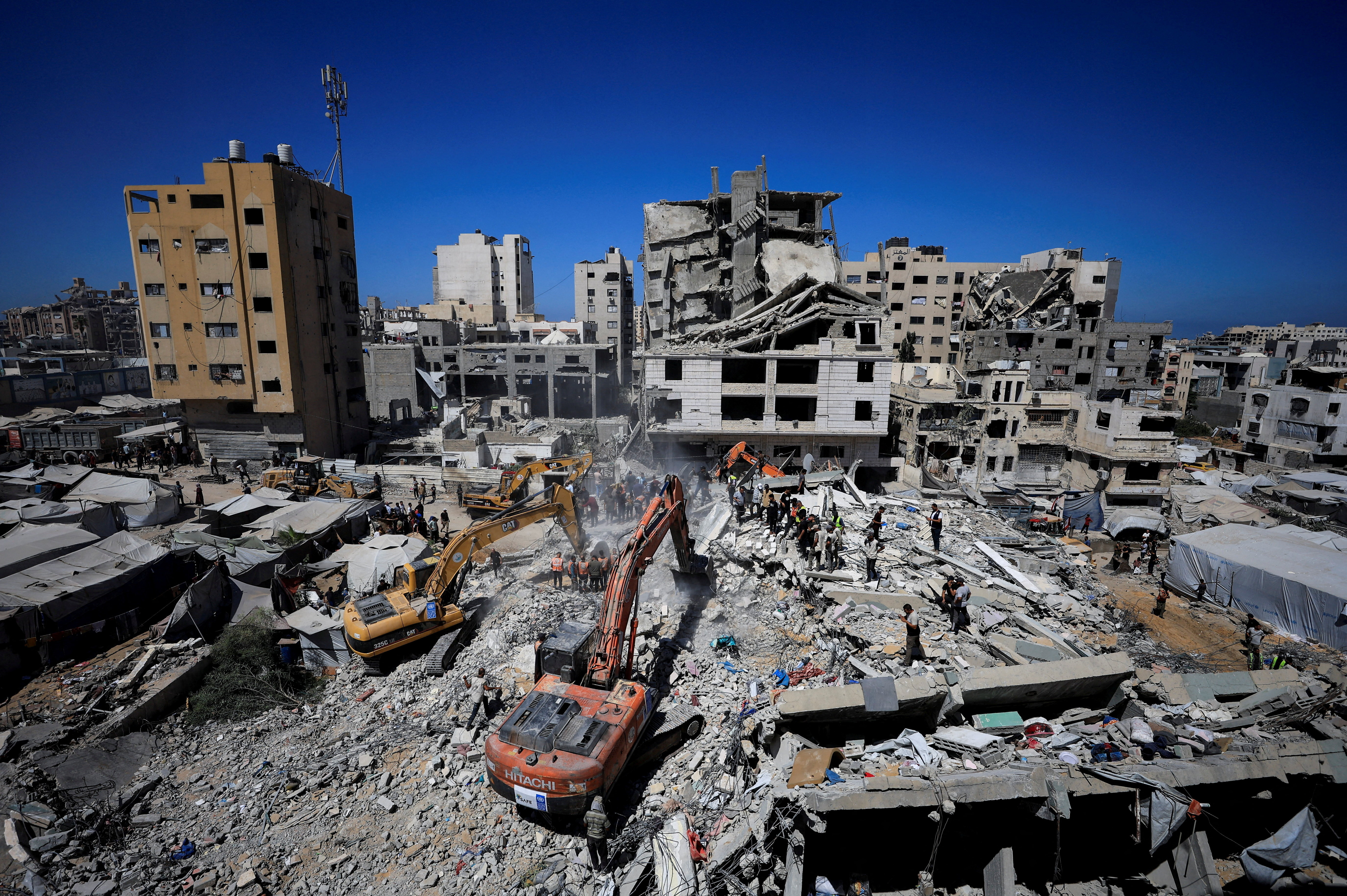 cover Rescue efforts end after 21 die in collapse of bomb-damaged building in Gaza; 45 saved from rubble