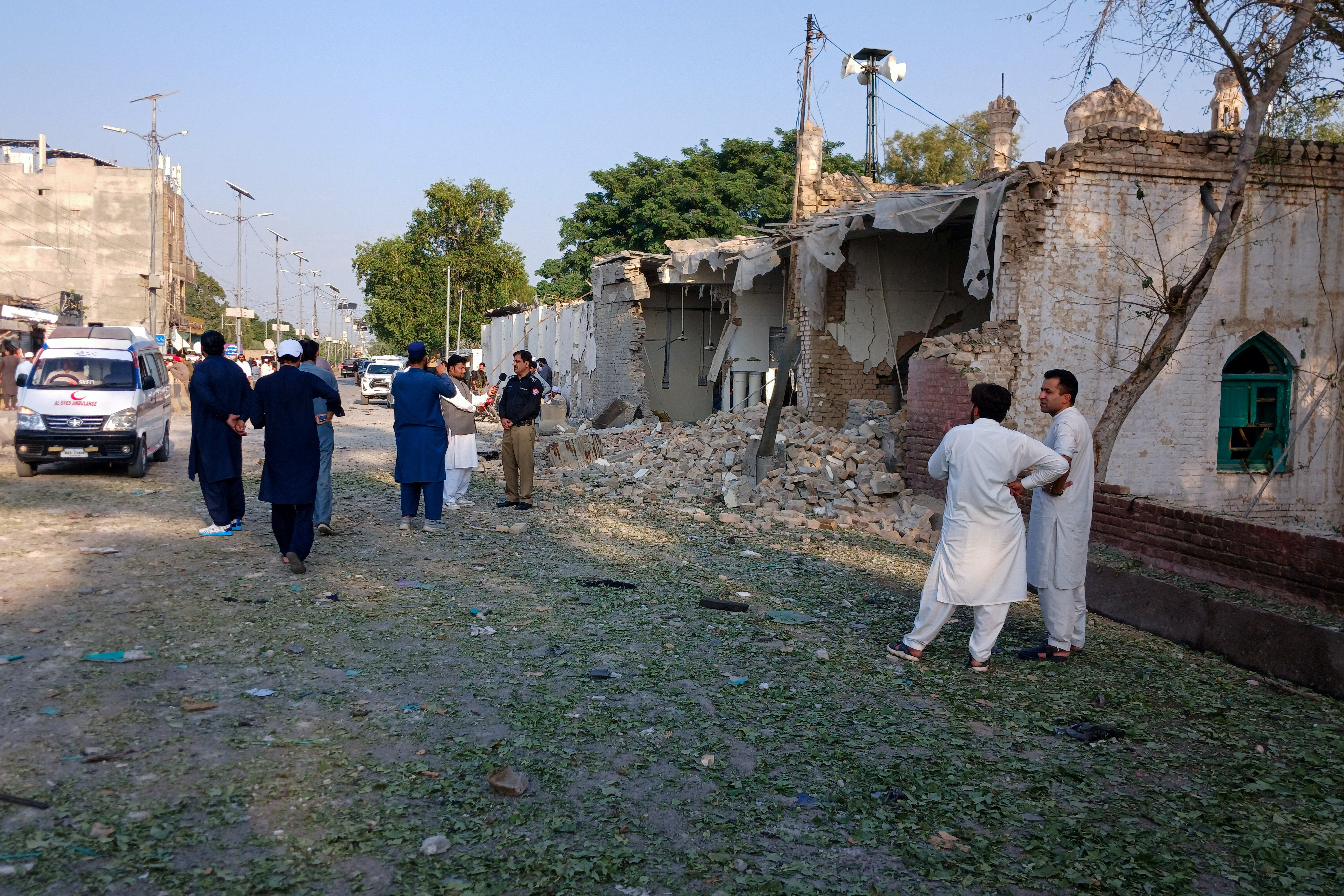 cover Suicide attack kills 16 near mosque in northwest Pakistan police compound