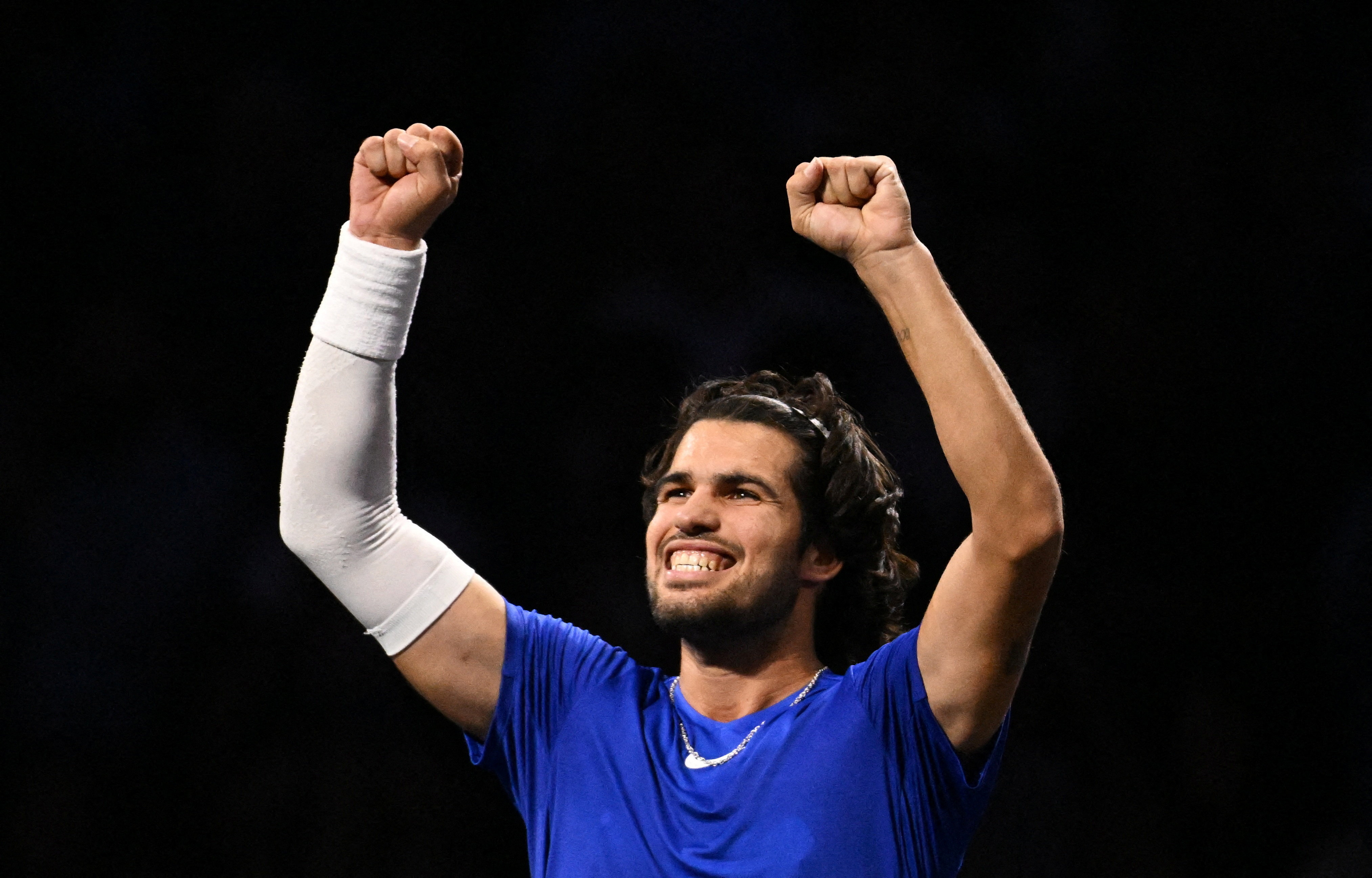 cover Alcaraz overcomes teething trouble on tweaked serve to beat Michelsen in Tokyo