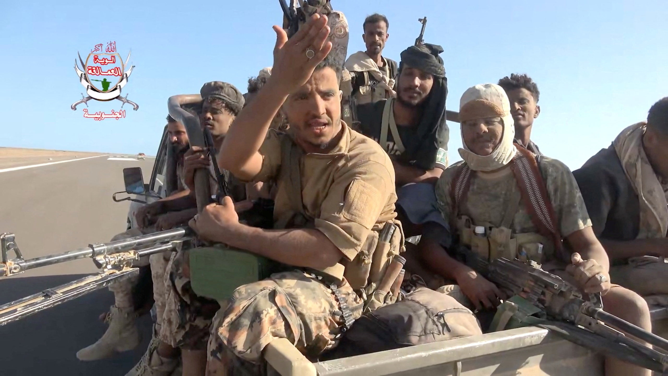 cover Yemeni government fighters recorded driving vehicles over Houthi opponents