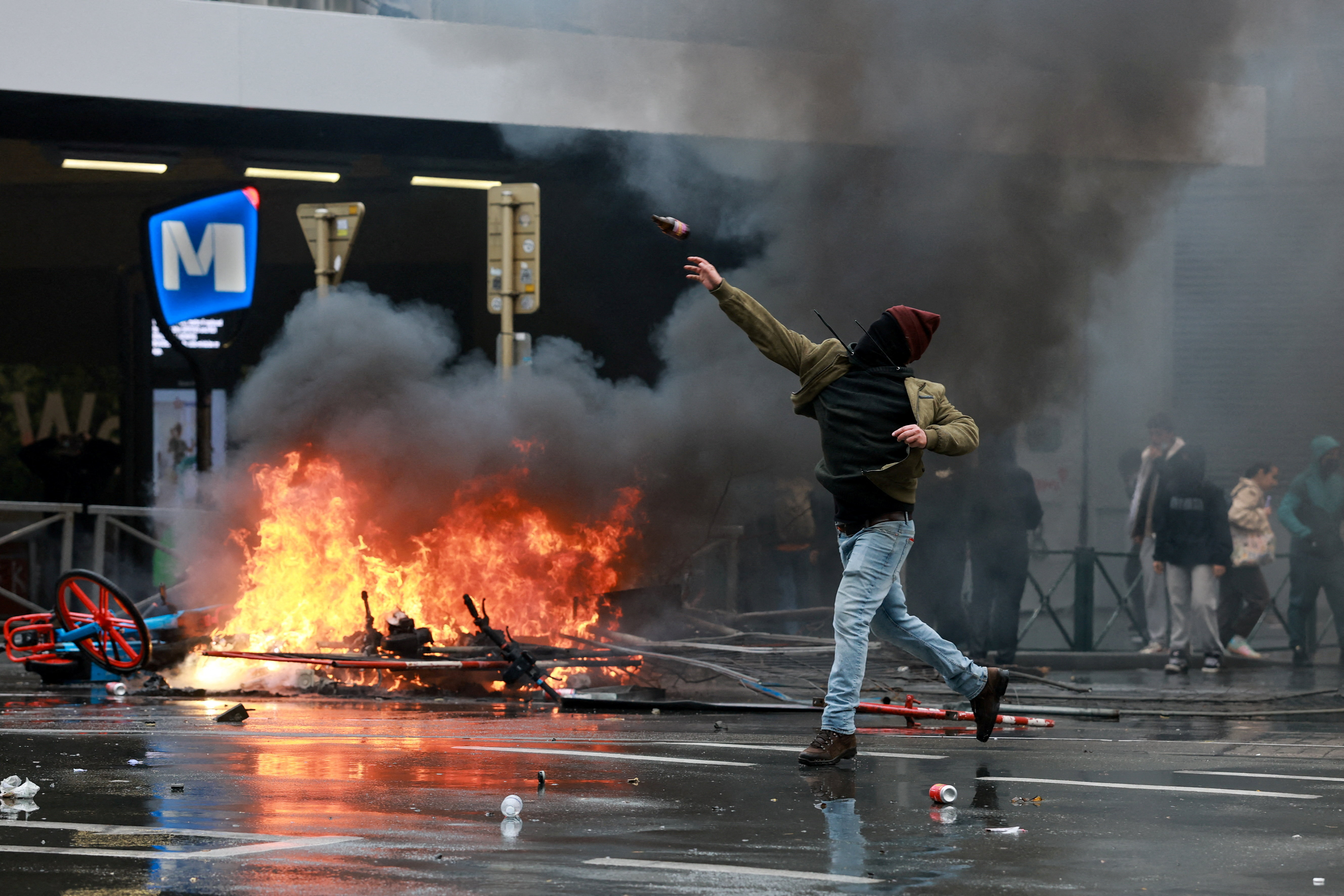 cover Protesters clash with police in Brussels as unions and students march