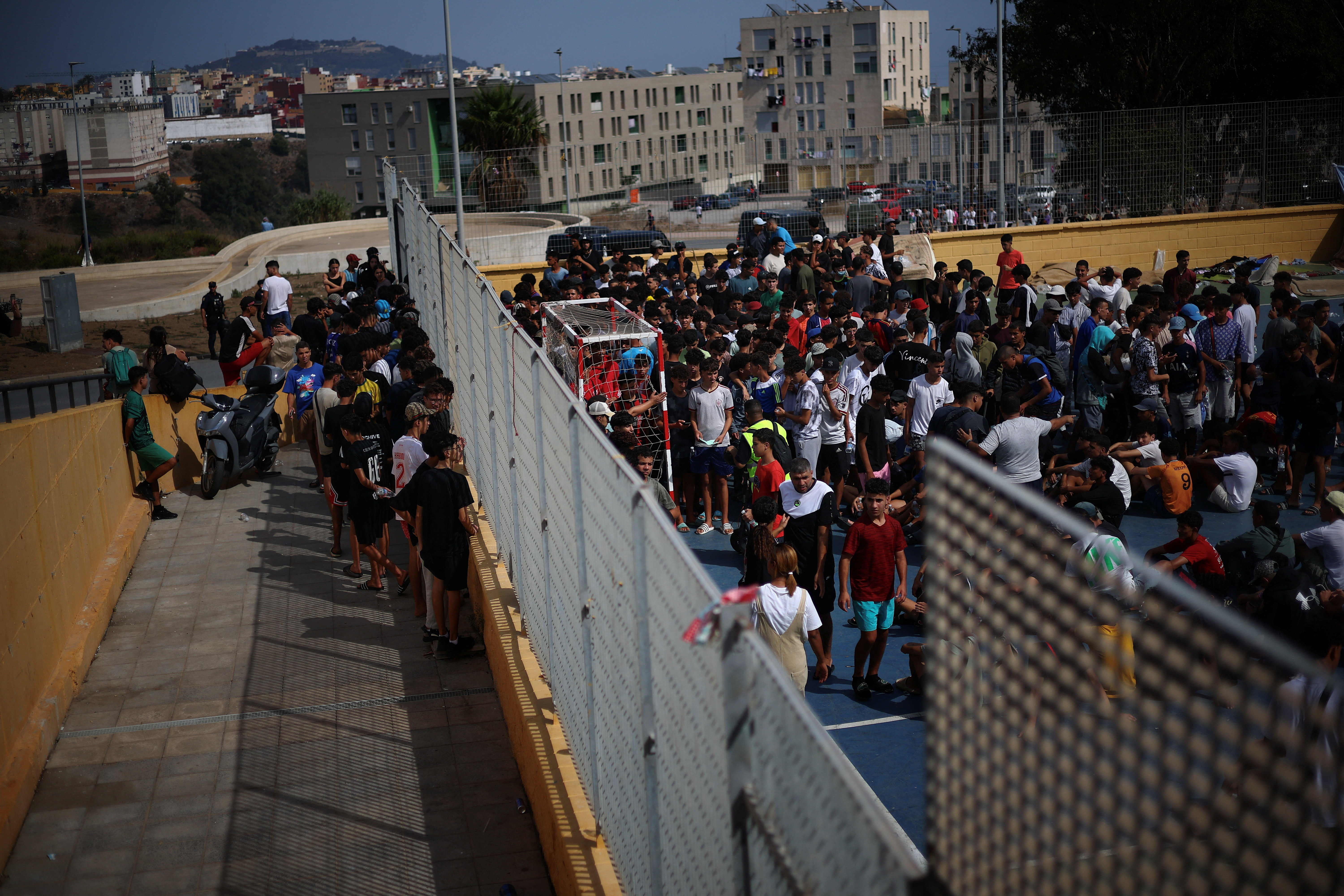 cover Spanish police clear migrant camp on Ceuta beach ahead of royal visit