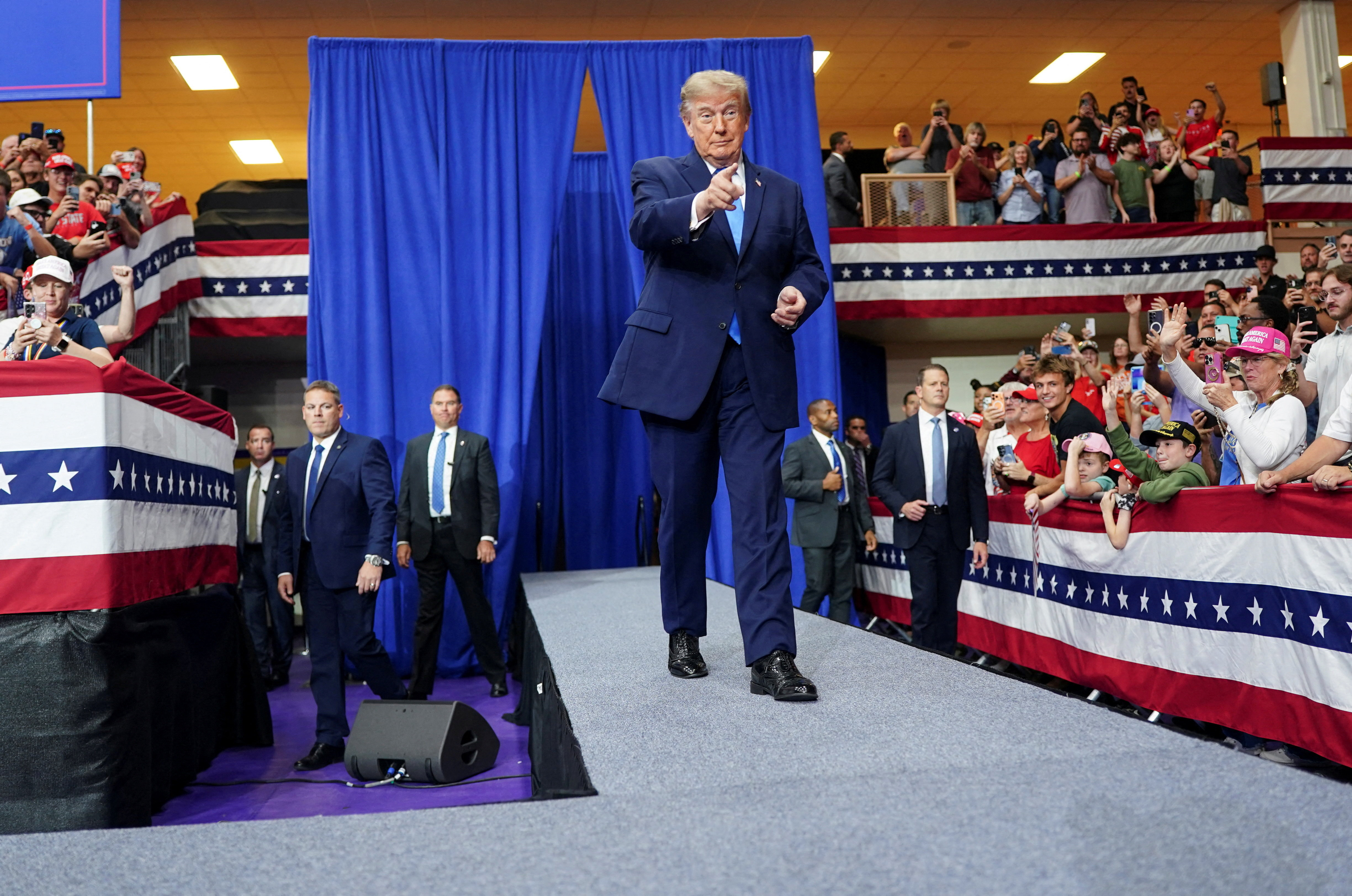 cover In crude Ohio rally speech, Trump says he may not help if Democrats win